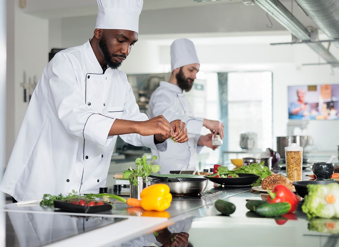 Insurance by Industry - Two Chefs Preparing a Meal